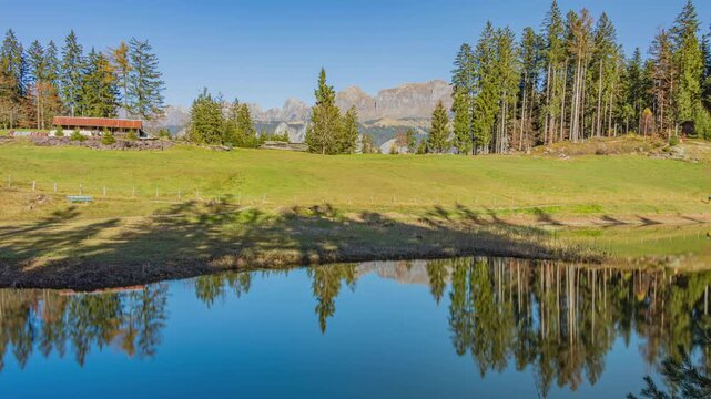 Time lapse, lake surrounded by the mountains. Lake Chapfensee, Hydroelectric reservoir high in the mountains. Mels, Canton of St. Gallen, Switzerland.