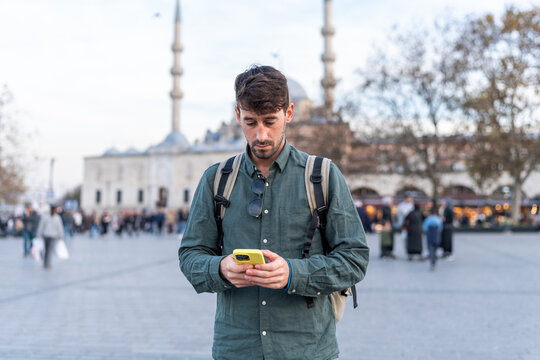Traveler checking phone in Istanbul city square