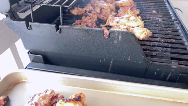 Juicy Chicken Thighs Being Grilled to Perfection on a Small Weber Grill