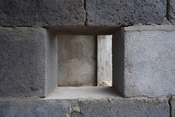 Window opening concrete block masonry wall rough texture urban site