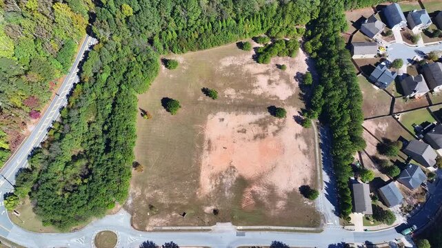 Aerial of housing development land surrounded by park, townhomes and condos, Butner road, Springbox Dr, Fairburn, Atlanta, Georgia, Aerial