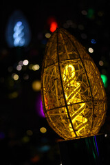 The garland lights glow on the Christmas tree