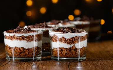 Chocolate layered dessert layered with mascarpone cream in glass cups
