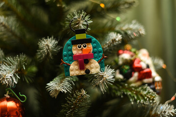 Fototapeta premium New Year's decorations for the tree. Lego snowman