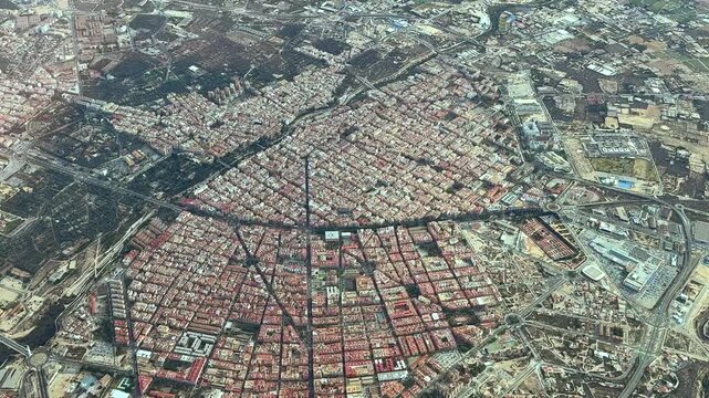 An elevated perspective of Elche city, captured from an airplane cockpit.