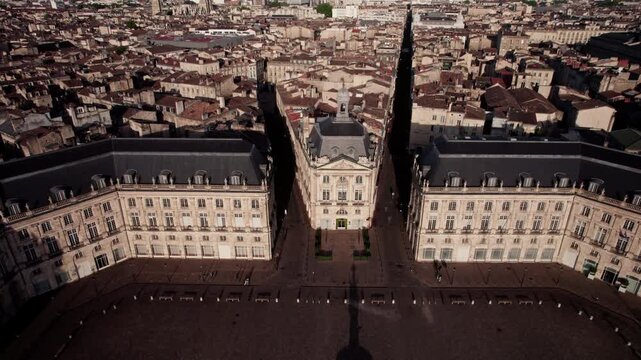 Bourdeaux, France. Aerial view with a sunny day. The city is full of tall buildings and a large clock tower. Panoramic drone shot with movement