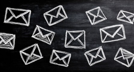 Chalkboard with drawn envelopes representing emails and communication.