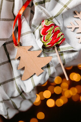 Vertical festive still life with holiday decor, greenery and ornaments. Cozy winter mood and warm seasonal styling.