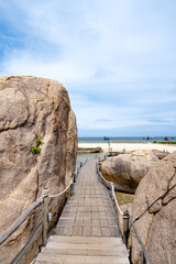 Wooden Boardwalk Through Rocky Cliffs Leading to Quiet Beaches Thailand&rsquo;s Hidden Gem | Summer & Winter Tourism | Unspoiled Natural Beauty | Relaxing Coastal Retreat | Off-the-Beaten-Path Destination