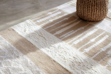 Low-angle horizontal shot along the edge of a modern rug with traditional patterns, focusing on texture and pattern details, warm soft light, minimal neutral interior, realistic fabric textures.