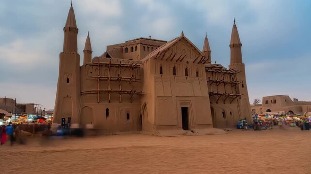 Time-lapse video of the Great Mosque featuring traditional mud architecture