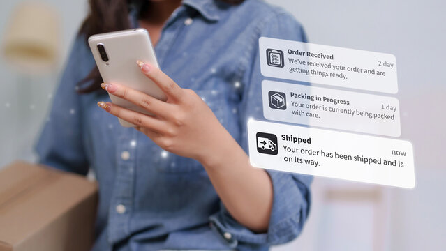 Asian adult woman customer checks online order status on smartphone receiving delivery box ecommerce tracking mobile app notification digital retail purchasing
