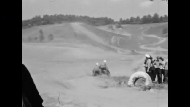 Extreme sidecar motocross race. Motorcycle racers speeding on offroad track watched by enthusiastic crowd. Championship rider on motorbike. Danger competition old film. Archival retro. Vintage archive