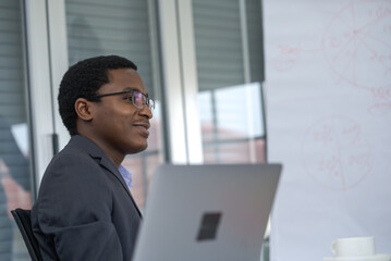 The businessman and computer.  Black businessman