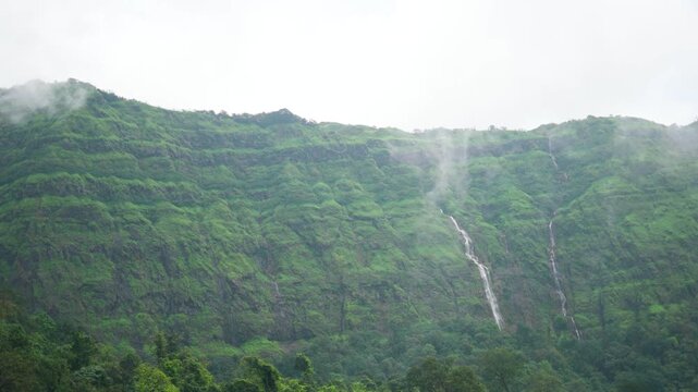 4K Slow motion shot of a waterfall in the Sahyadri hills at Maharashtra during the monsoon season near Lonavala, India. Scenic waterfall in the western Ghats during rainy season. Nature background.