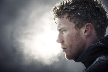 Man breathing cold winter air outdoors