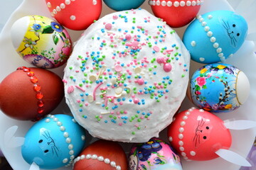 Traditional Easter Kulich Surrounded by Colorful Decorated Eggs top view
