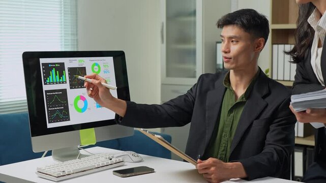 Businessman analyzing financial data dashboard on computer