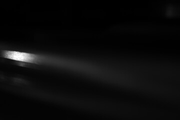 Soft Light Streak Texture. Soft horizontal light streak on dark background. Suitable for overlays, cinematic design and modern visual effects.