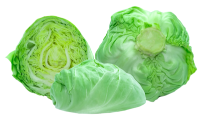 group of three fresh green cabbages photographed from above, one cut to expose the inside concentric leaf patterns of this cruciferous vegetable.