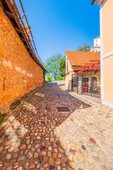 Charming old cobbled stone street in the historic old town of Ptuj, Slovenia