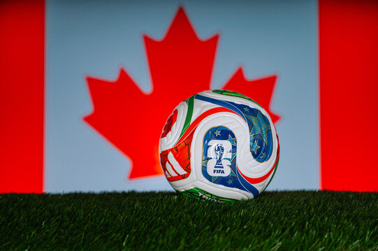 FIFA World Cup 2026 backdrop with the Canada flag and clean black edit space for graphics Official Trionda ball on green Grass