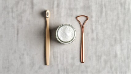 Natural oral care routine with bamboo toothbrush tongue scraper and baking soda for healthy teeth and gums