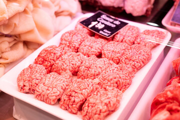 Raw sheep brains on counter of butcher shop