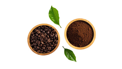 Coffee beans and ground coffee in wooden bowls with green leaves on black background, top-down perspective