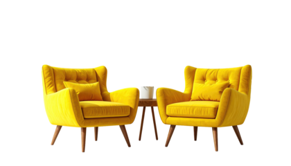 Two matching, bright yellow armchairs and a small round table with a mug set against a black background