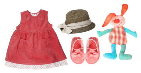 adorable baby girl's apparel and toy set arrangement photograph perfect for children's fashion blogs and baby product marketing material designs.