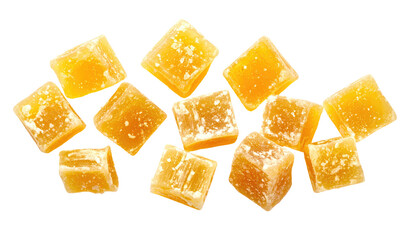 Pile of candied ginger pieces, showing translucent, square, and textured orange-yellow cubes