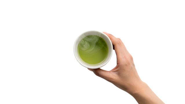 A hand holding a hot ceramic cup of green tea - Powered by Adobe
