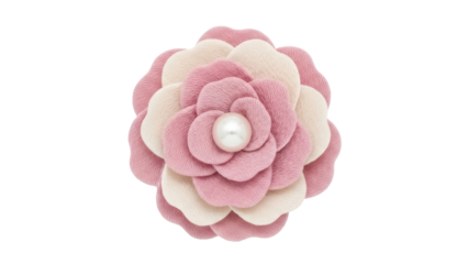 Isolated camellia flower brooch accessory, pink and cream petals with pearl in the center