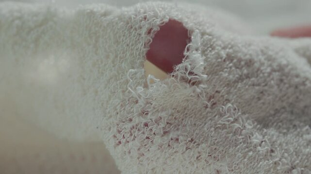 Tiny hole in  white cloth
