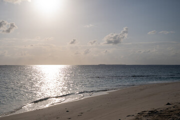 White Sand Beach and Crystal-Clear Sea, Maldives, during the sunrise. 