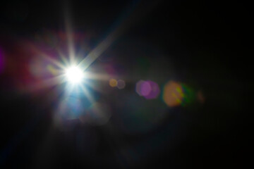 Hexagon sun beam and lens optical flare effect on black background for overlay designs