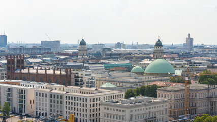 Aerial view of the architectural tapestry of Berlin, where the Berliner Dom and Neue Kirche rise amidst a sea of buildings, Berlin Mitte, Berlin, Germany.