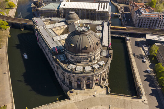 Aerial view of Bode Museum standing majestically on the tip of Museum Island, its dome reflecting the soft light, surrounded by the Spree River, Berlin Mitte, Berlin, Germany.