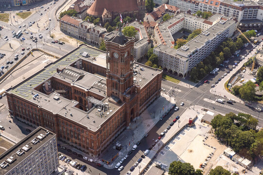 Aerial view of the Rotes Rathaus, a striking red-brick building with its iconic tower, stands amidst the bustling cityscape, Berlin Mitte, Berlin, Germany.