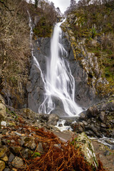 Long exposure image of a waterfall and mountain river; Aber Falls, Rhaeadr Fawr,Snowdonia Wales
