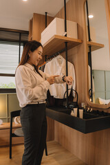 Happy Asian couple enjoying time together in their new home