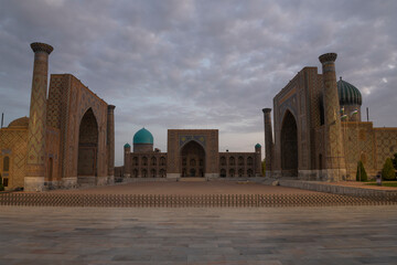 View of the ancient Registan Square on the early cloudy morning. The historical center of Samarkand