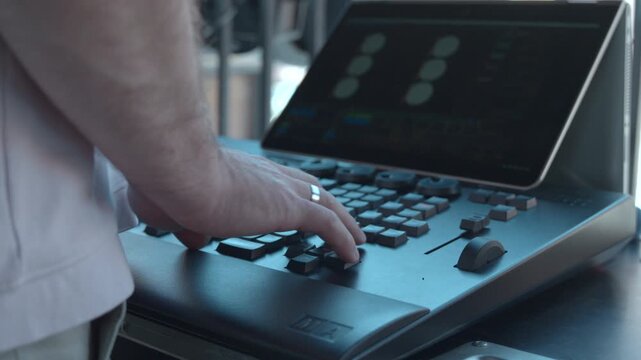 Performing Musician Skillfully Adjusting Equipment To Perfectly Align Beats During Energetic Recording Session. Media