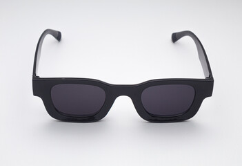 Trendy Black Sunglasses with Dark Lenses Isolated on White Background