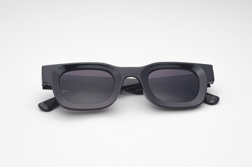 Trendy Black Sunglasses with Dark Lenses Isolated on White Background