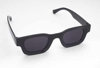 Trendy Black Sunglasses with Dark Lenses Isolated on White Background