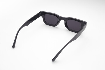 Trendy Black Sunglasses with Dark Lenses Isolated on White Background