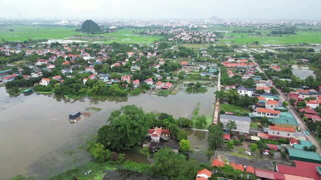 Asia, Ninh B&igrave;nh and Tam Coc  in the Red River Delta region of Vietnam -  limestone karst formations emerge from rice paddies and rivers "Halong Bay on Earth" -  countryside flooded by typhoon