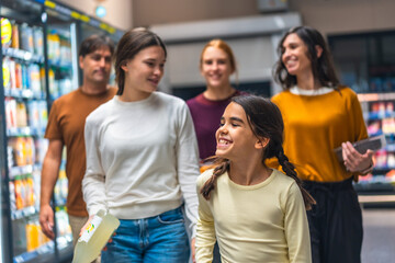 Obraz premium Family shopping for groceries together enjoying supermarket aisle